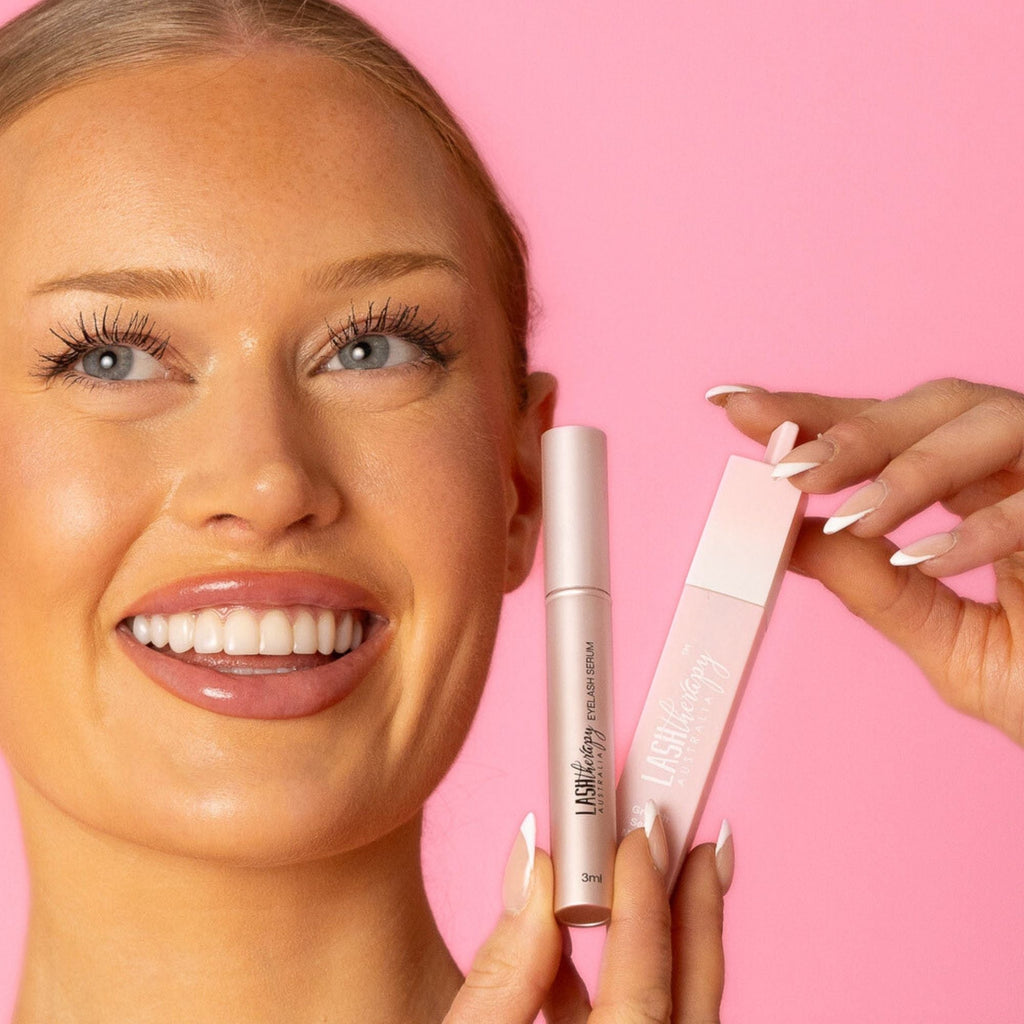 Model holding Lash Therapy Australia eyelash serum and Everylash conditioning mascara