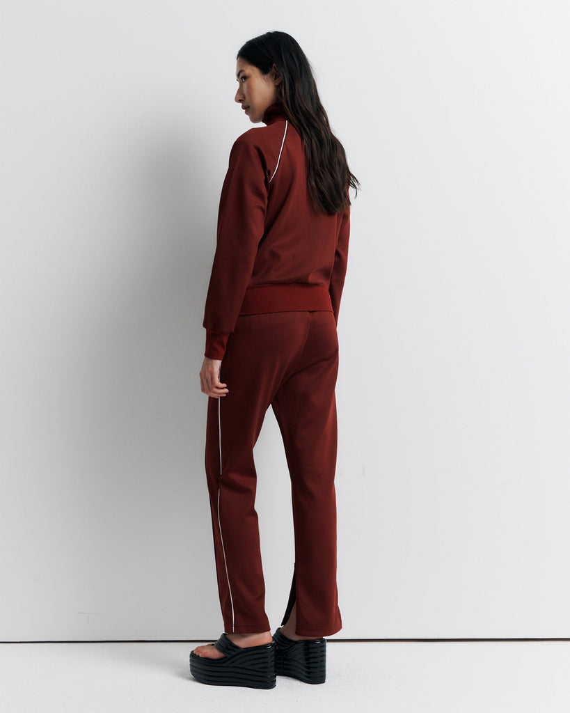 The RAS Sweater is a sports-inspired zip-front jacket featuring a high neck, contrast piping, and a slim fit. Designed with side zip pockets, chunky ribbed cuffs and hem, and finished with our signature Romy Athletic Society 'R' embroidery at the front.