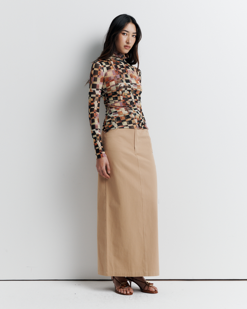 The Blake Top – Double-layer mesh funnel neck with side seam gathering to flatter the form, bell sleeves, and exclusive artwork by Phoebe Wills.