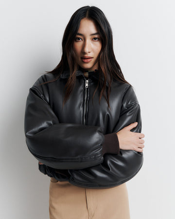 Stay warm and stylish in our chocolate brown, vegan leather Padded Bomber Jacket. Crafted with a super soft feel, gathered hem, and ribbed knit cuffs... it's a must-have. Shop now!