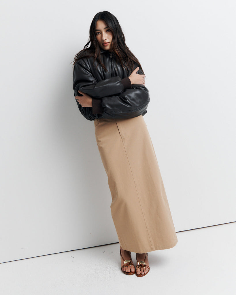 Stay warm and stylish in our chocolate brown, vegan leather Padded Bomber Jacket. Crafted with a super soft feel, gathered hem, and ribbed knit cuffs... it's a must-have. Shop now!