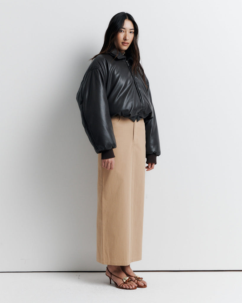 Stay warm and stylish in our chocolate brown, vegan leather Padded Bomber Jacket. Crafted with a super soft feel, gathered hem, and ribbed knit cuffs... it's a must-have. Shop now!