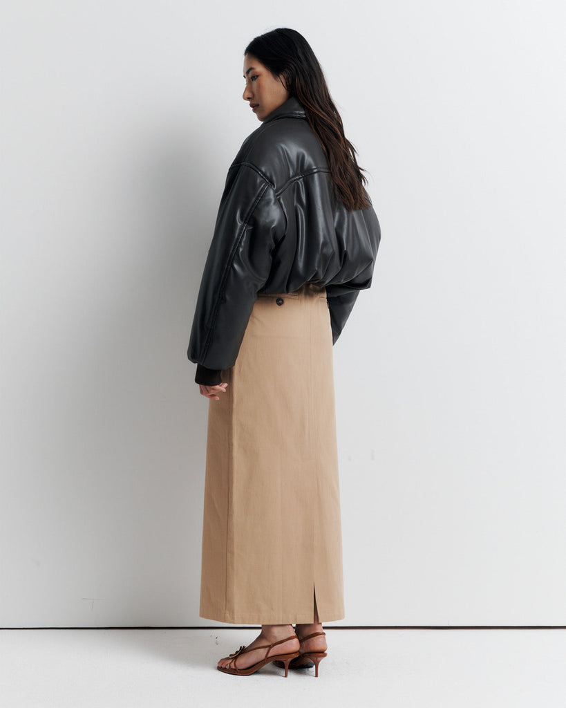 Stay warm and stylish in our chocolate brown, vegan leather Padded Bomber Jacket. Crafted with a super soft feel, gathered hem, and ribbed knit cuffs... it's a must-have. Shop now!