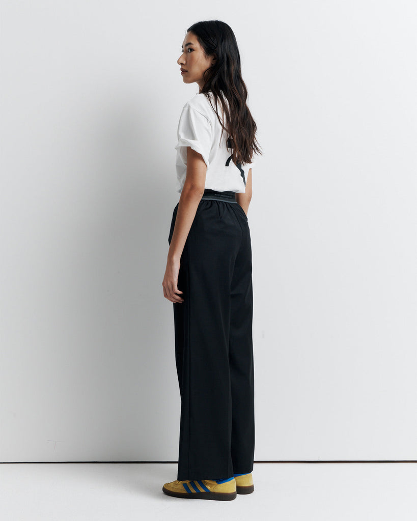 The RAS Pant by Romy Athletic Society combines everyday comfort with elevated style. Crafted from a luxurious wool blend, it features a sporty elastic waistband, side pockets, a faux fly, and a single welt back pocket.