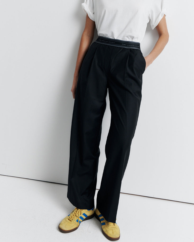 The RAS Pant by Romy Athletic Society combines everyday comfort with elevated style. Crafted from a luxurious wool blend, it features a sporty elastic waistband, side pockets, a faux fly, and a single welt back pocket.