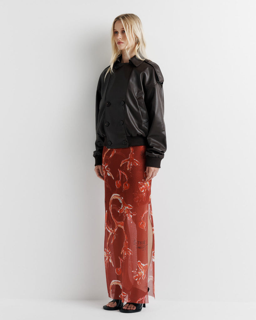 Elevate your wardrobe with the Blair Jacket – a unique bomber-meets-cropped-trench crafted from signature vegan leather. Cinched cuffs and waistband sculpt a flattering silhouette, while the relaxed fit offers effortless drape