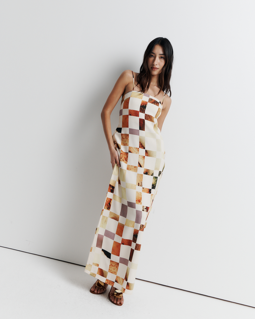 The Rochelle Dress – A sleek column silhouette with a straight neckline, rouleau straps, and internal bustier support. Features exclusive artwork by Phoebe Willis. Shop now!
