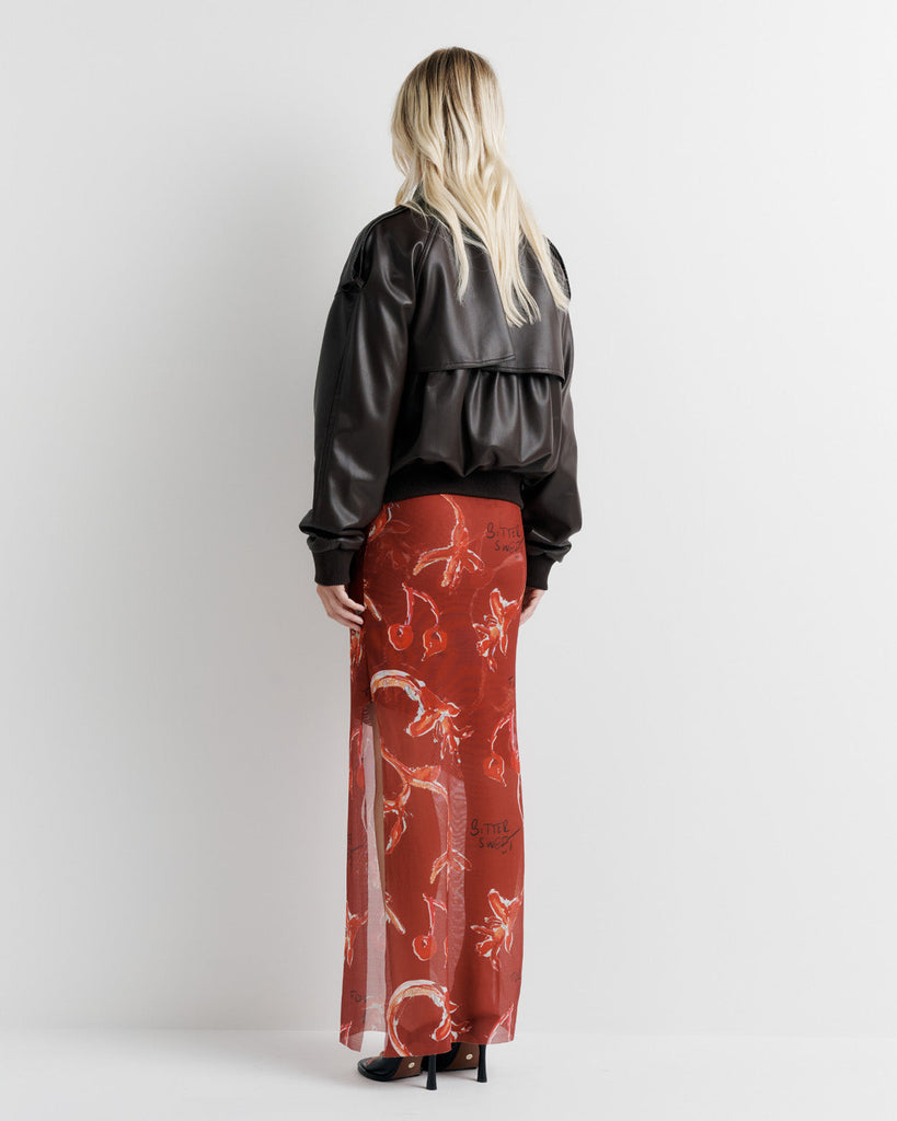 Elevate your wardrobe with the Blair Jacket – a unique bomber-meets-cropped-trench crafted from signature vegan leather. Cinched cuffs and waistband sculpt a flattering silhouette, while the relaxed fit offers effortless drape