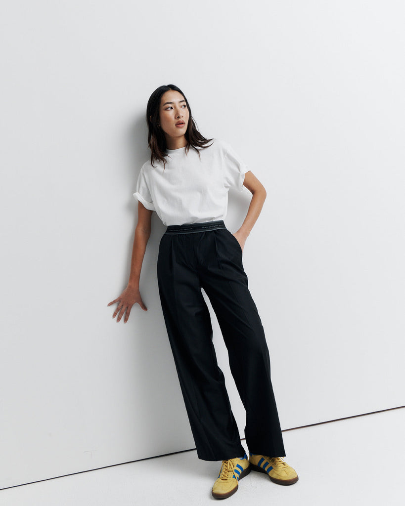The RAS Pant by Romy Athletic Society combines everyday comfort with elevated style. Crafted from a luxurious wool blend, it features a sporty elastic waistband, side pockets, a faux fly, and a single welt back pocket.