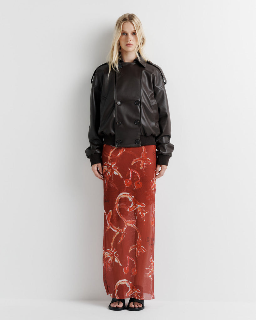 Elevate your wardrobe with the Blair Jacket – a unique bomber-meets-cropped-trench crafted from signature vegan leather. Cinched cuffs and waistband sculpt a flattering silhouette, while the relaxed fit offers effortless drape